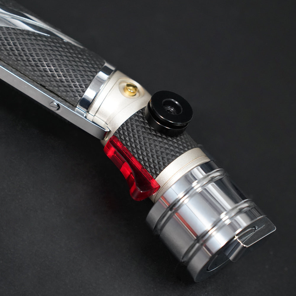 Close-up of the Dooku black belt clip wheel, red accent, and polished pommel section