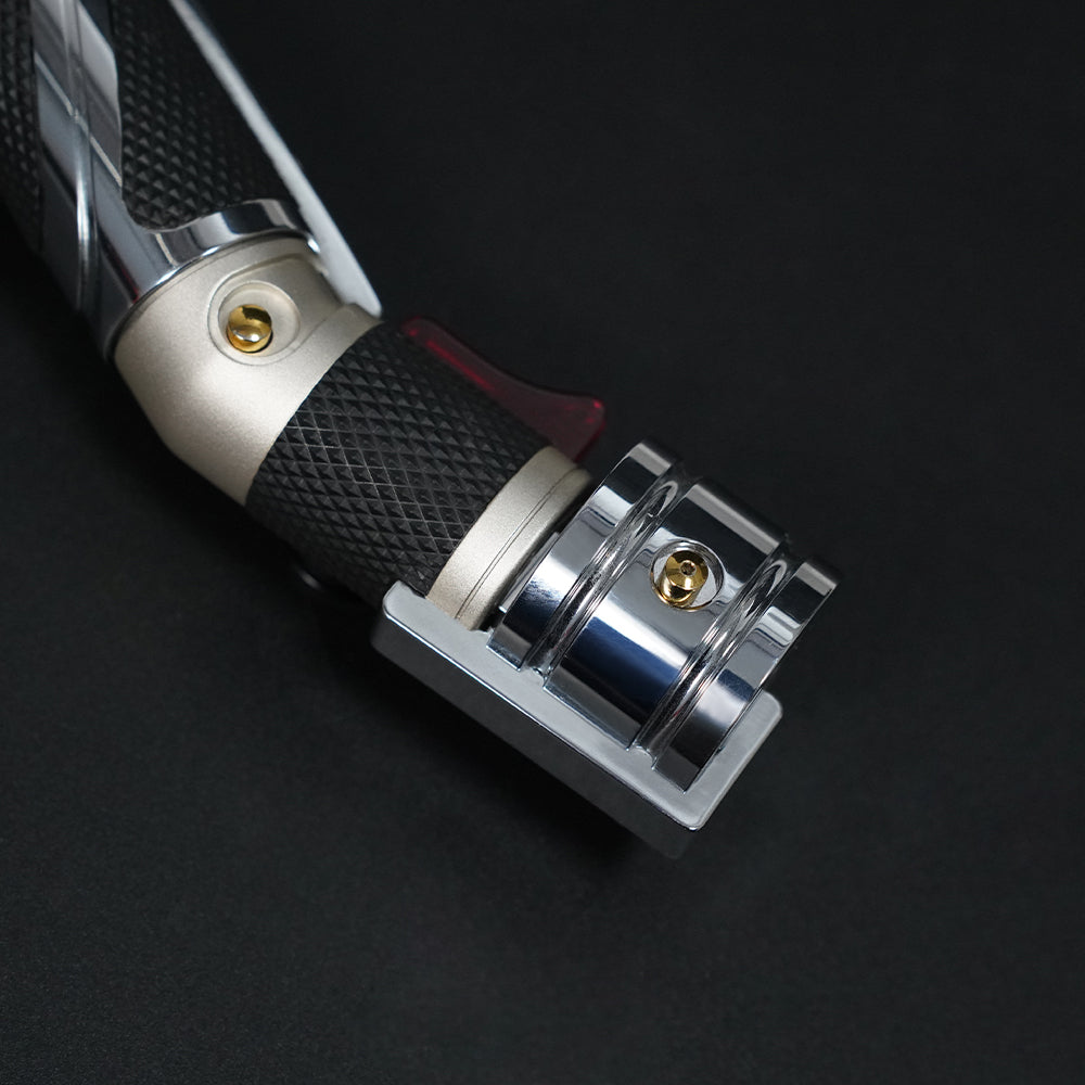 Dooku hilt control section with gold button, textured grip, red accent, and chrome end