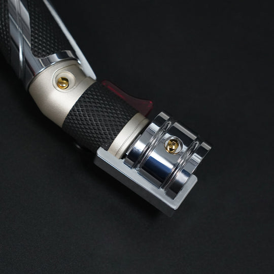 Dooku hilt control section with gold button, textured grip, red accent, and chrome end