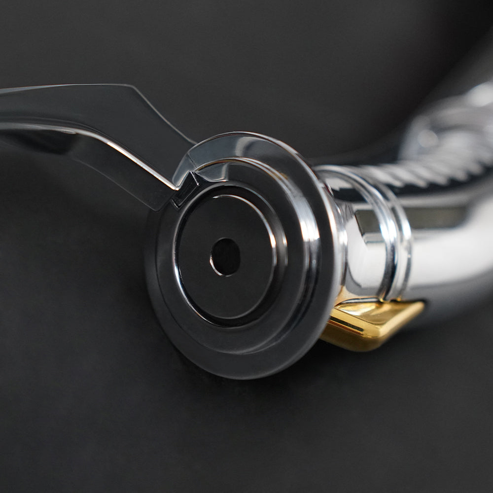 Close-up of the Dooku emitter and blade plug with curved guard and gold accent