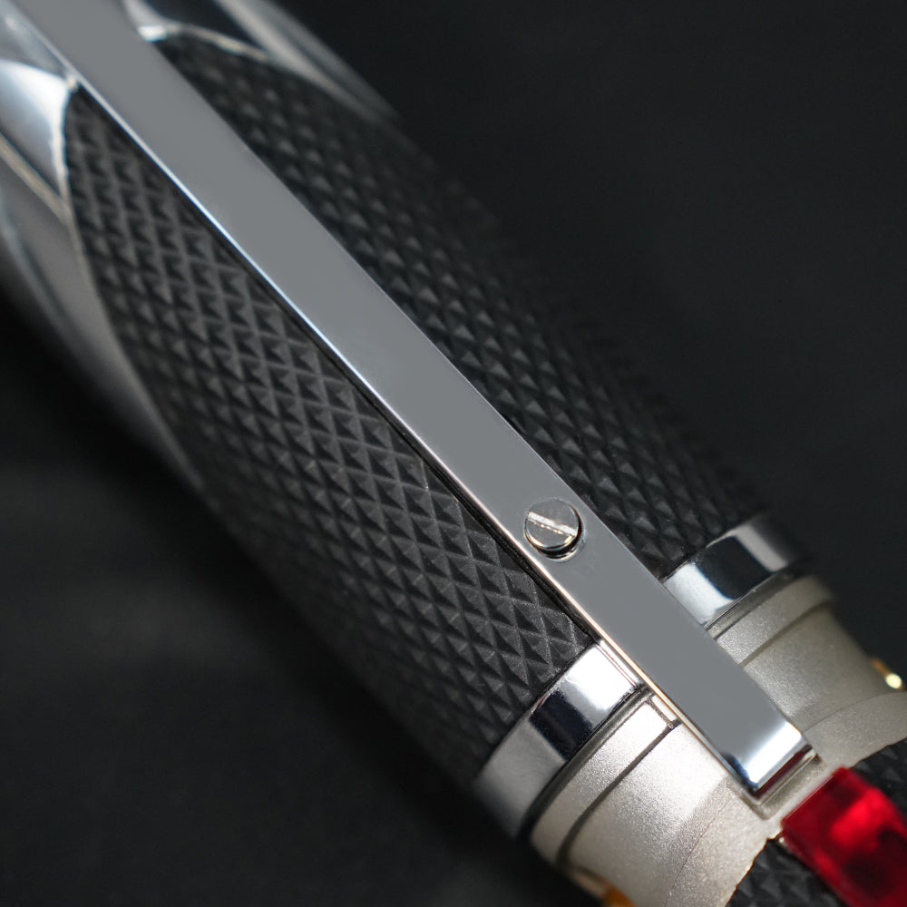 Close-up of the Dooku textured black grip, chrome rail, and hilt fastener