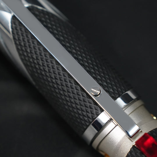 Close-up of the Dooku textured black grip, chrome rail, and hilt fastener
