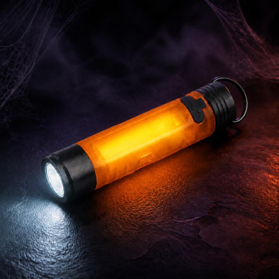 Rechargeable orange keychain flashlight with front and side lights illuminated